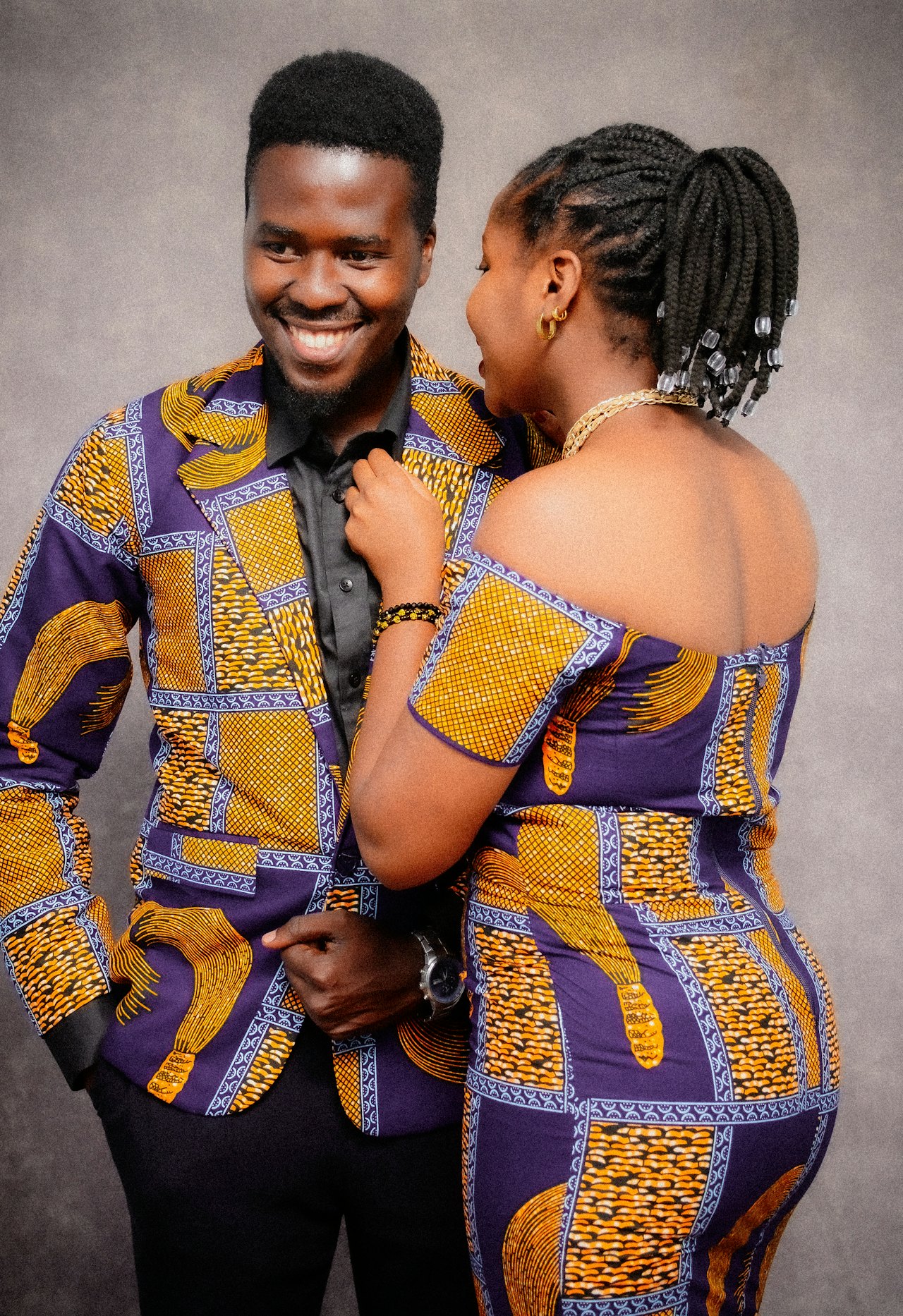 A couple in matching African print outfits