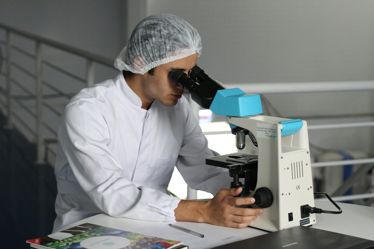 A person looking through a microscope