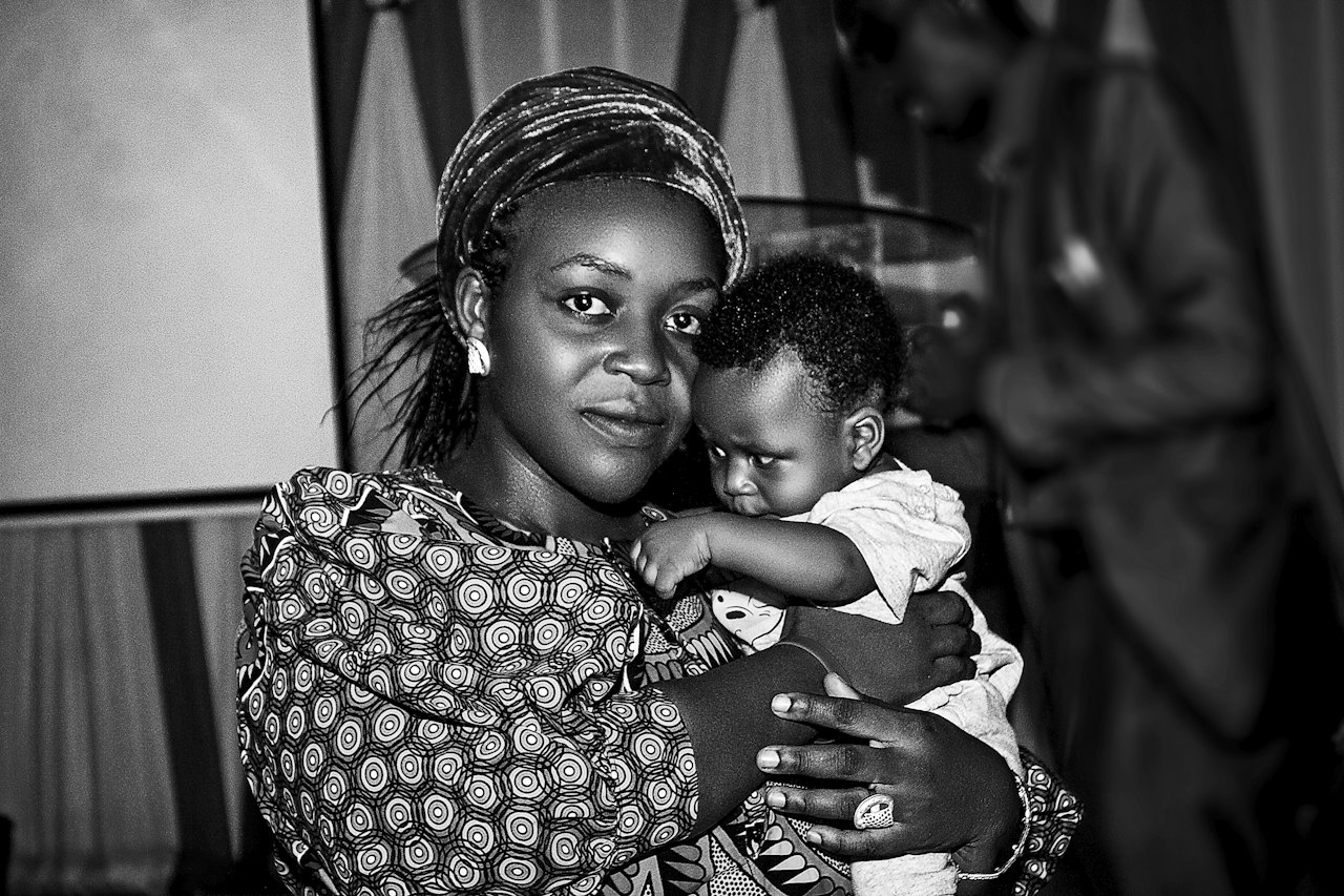 A mother holding her baby tenderly