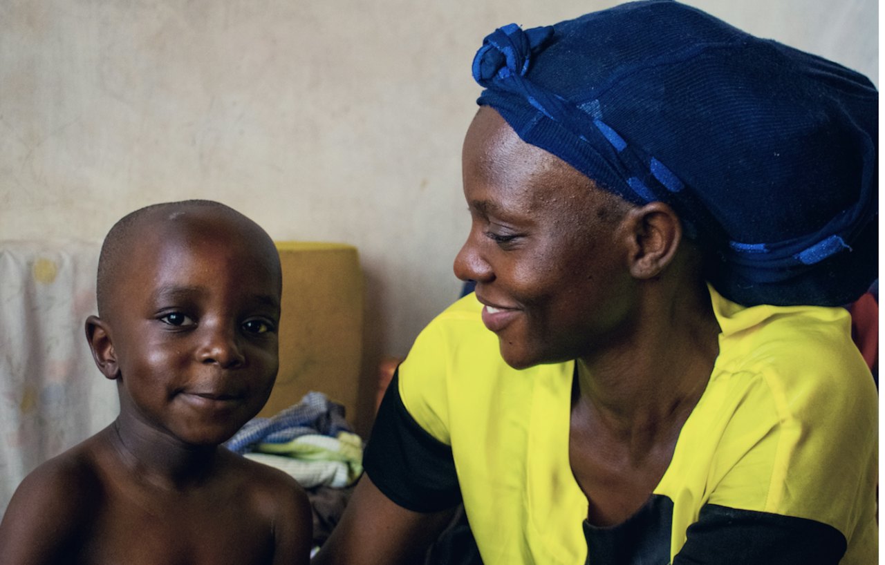 A mother and her son smiling together