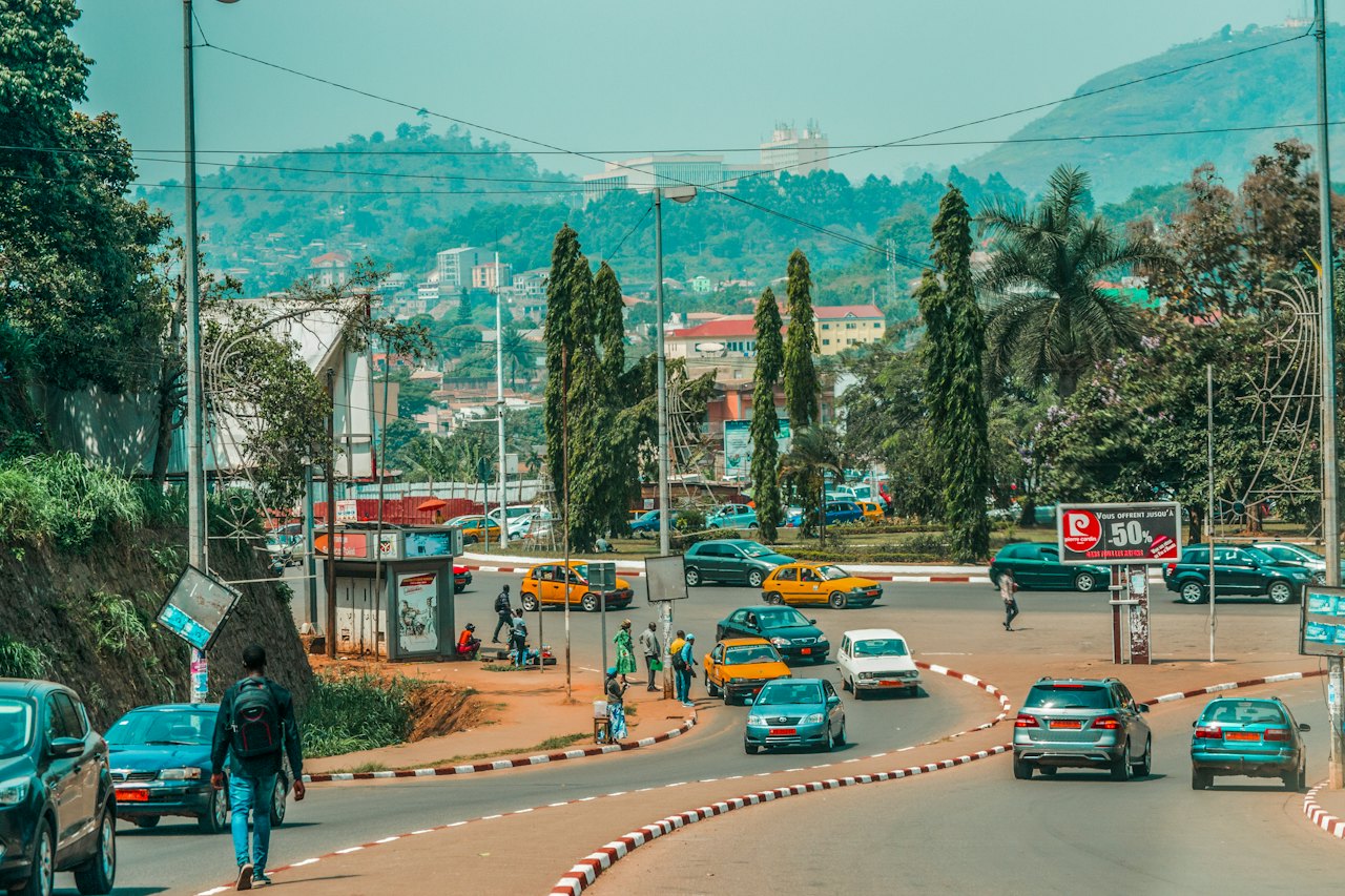 A busy street in a Cameroonian city on a sunny day